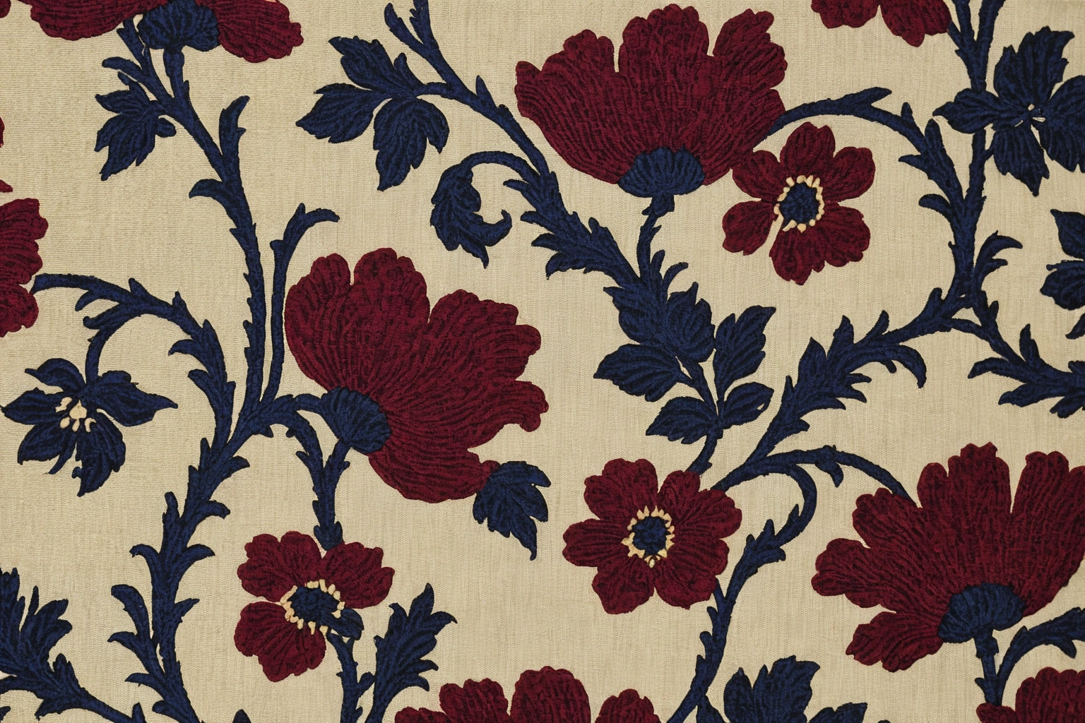 Macro photograph of jacquard woven furnishing fabric with a large floral motif in silk and chenille yarn